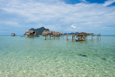 Scenic view of sea and buildings against sky