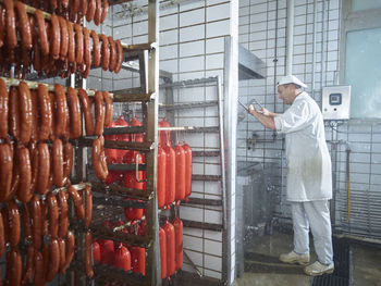 Butcher washing machinery with water in factory