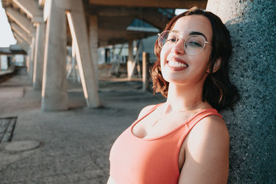 Portrait of young woman standing outdoors