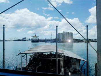 Harbor by sea against sky