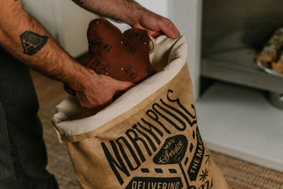 Cropped hand of woman holding gift