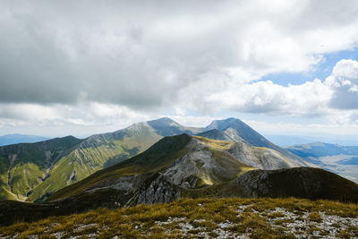 Scenic view of mountains against sky in montemonaco, marche italy