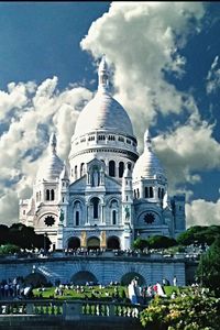 Low angle view of temple against cloudy sky