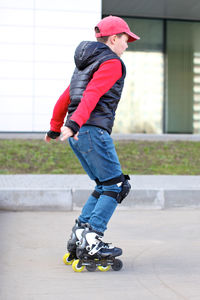 Full length of man skateboarding on skateboard