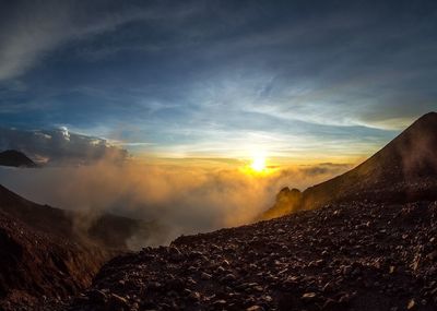 Scenic view of mountains against sky during sunset