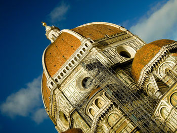 Low angle view of florence cathedral against blue sky