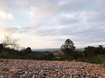 Scenic view of land against sky during sunset