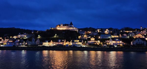 Illuminated buildings in city at night