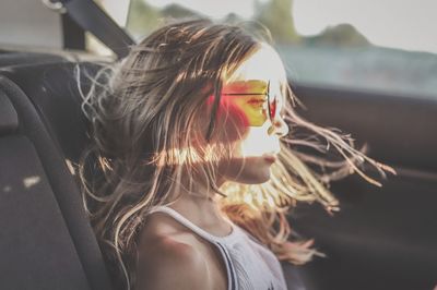 Close-up portrait of woman wearing sunglasses