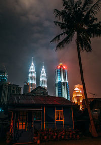 Low angle view of skyscrapers lit up at night