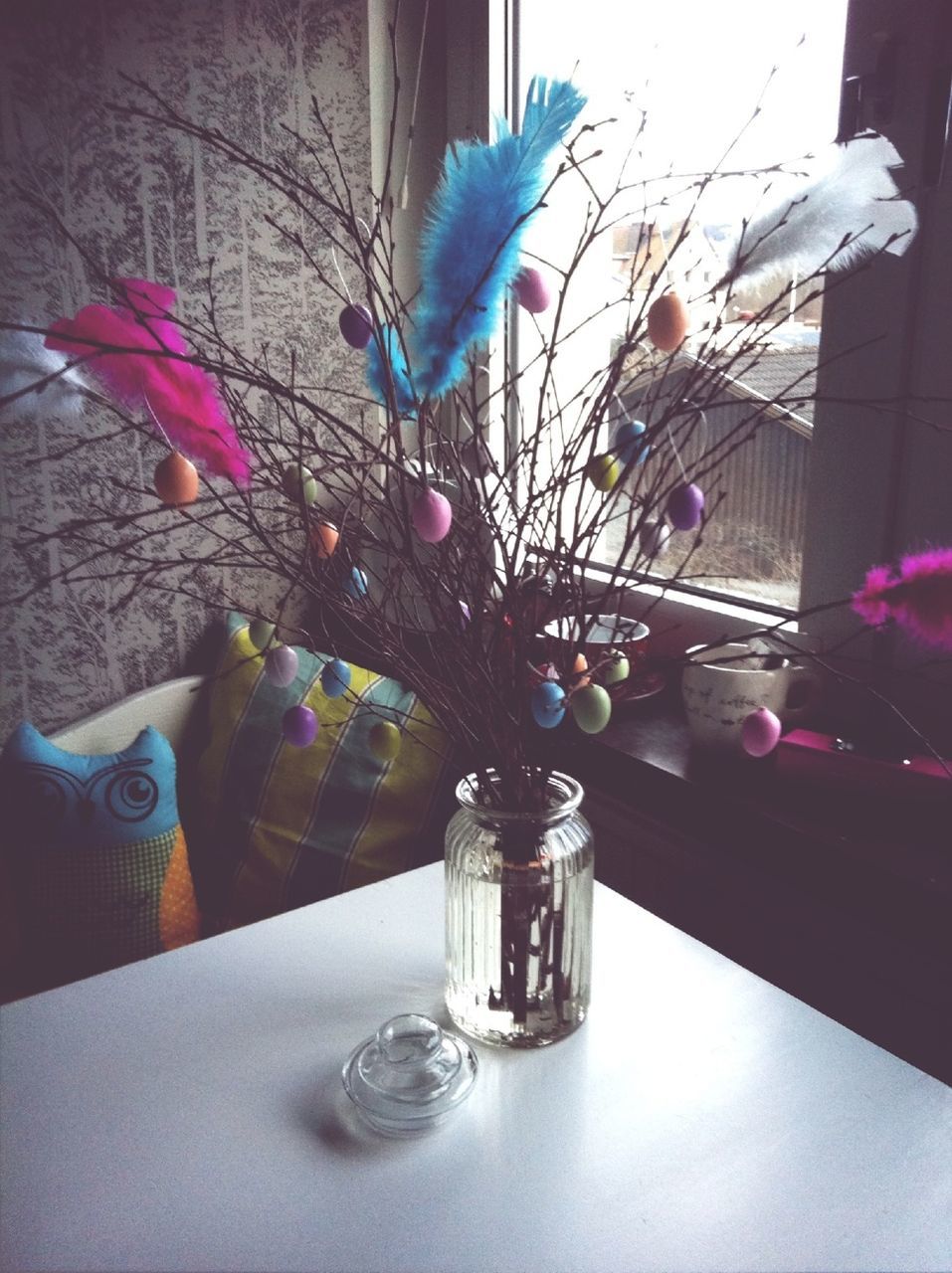 indoors, glass - material, table, flower, vase, transparent, decoration, home interior, fragility, still life, drinking glass, freshness, window, close-up, bottle, glass, no people, drink, multi colored, potted plant