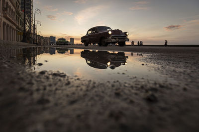 Reflection of clouds in puddle