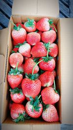 High angle view of strawberries in box