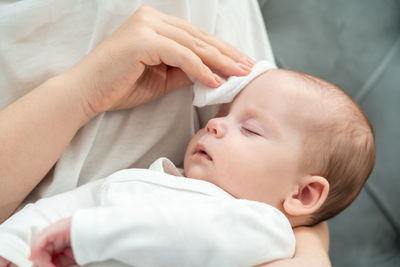 Cropped hand of doctor examining patient