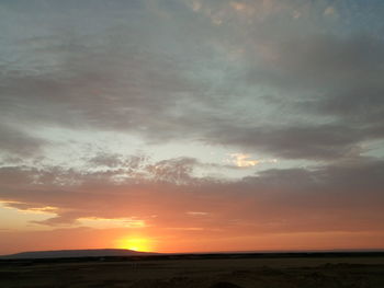 Scenic view of landscape against sky during sunset