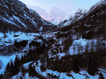 Scenic view of snow covered mountains against sky