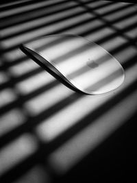 Close-up of metal on table against wall