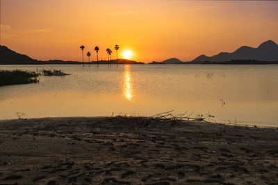 Scenic view of sunset over lake