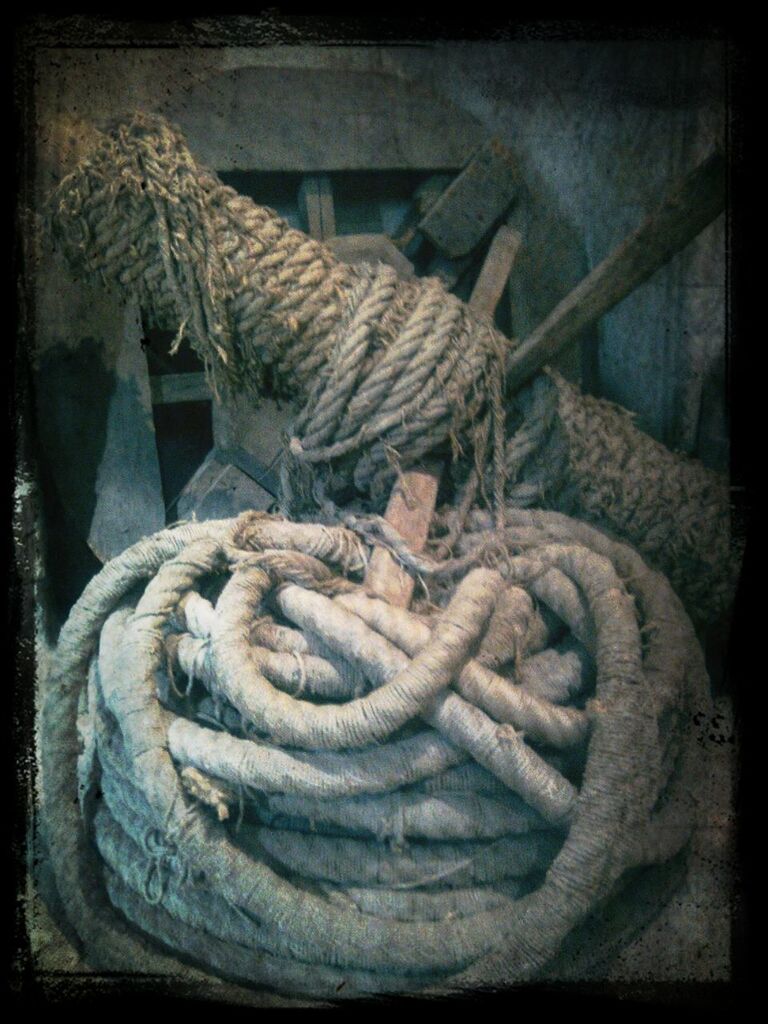 indoors, transfer print, close-up, auto post production filter, rope, still life, metal, wood - material, no people, high angle view, rusty, old, stack, table, day, focus on foreground, tied up, basket, metallic