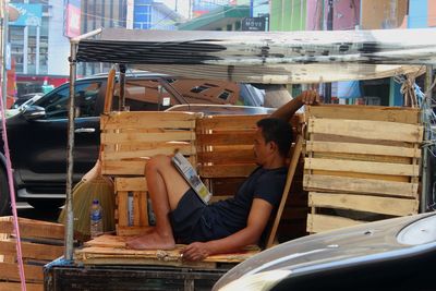 Rear view of man sitting on seat