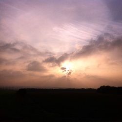 Scenic view of landscape against sky at sunset