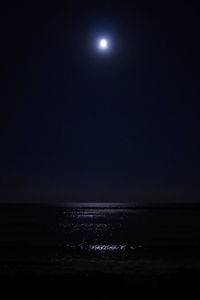 Scenic view of sea against sky at night