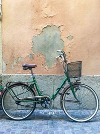 Bicycle leaning on wall
