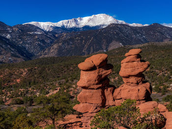 Rock formation on mountain against sky