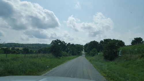 Road passing through field