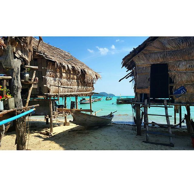 sea, water, beach, built structure, sky, architecture, sand, building exterior, horizon over water, shore, nautical vessel, moored, transfer print, auto post production filter, boat, abandoned, day, transportation, house, pier