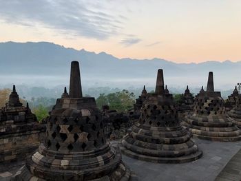 Stupas of building at sunset