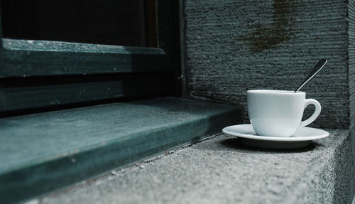 Close-up of coffee cup on steps