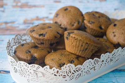 Close-up of muffins in container on table