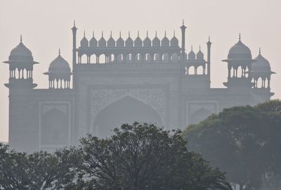 Front gate of the taj mahal on a smoggy winter morning 