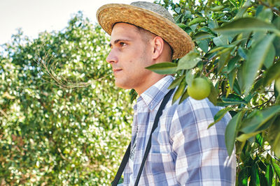 Portrait of man with vegetables in farm