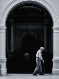 Full length of woman standing on railing