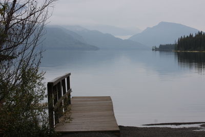 Pier over lake against sky