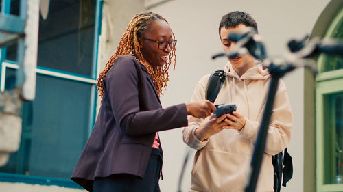 Side view of woman using mobile phone