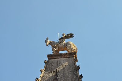 Low angle view of statue against clear sky