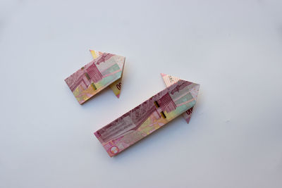High angle view of paper currency on white background