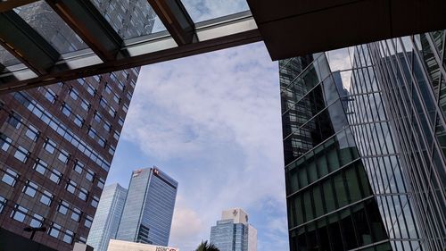 Low angle view of modern buildings against sky