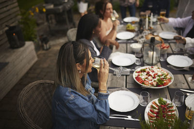 Friends having meal in garden