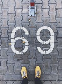 Low section of person standing on street