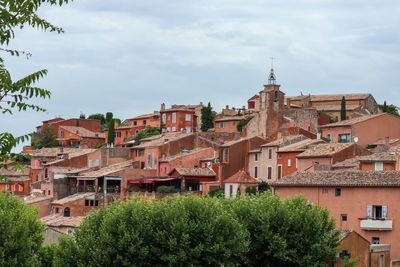 Houses in town against sky