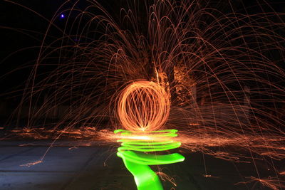 Wire wool at lakeshore during night