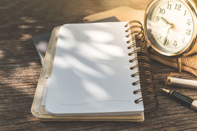 High angle view of clock on table