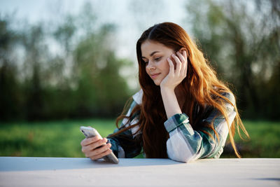 Young woman using mobile phone