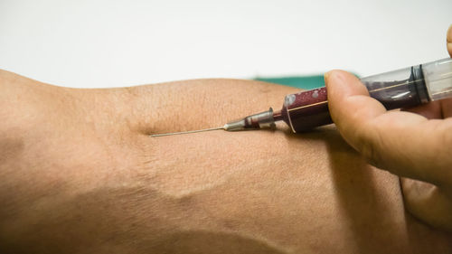 Close-up of hand holding camera