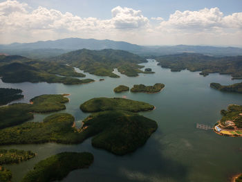 Scenic view of lake and mountains against sky