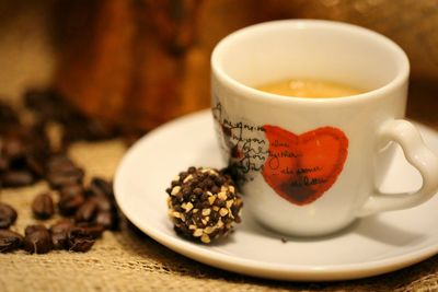 Close-up of coffee and snack on table